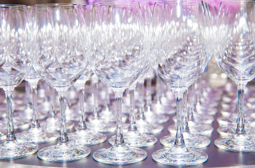 A lot of wine glasses in a row, catering background concept.