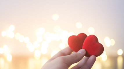 Red heart in hand, concept of Valentine's day