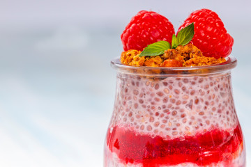Closeup of jar with chia and raspberry pudding