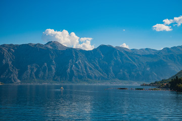 Mediterranean Landscape with Sailboat sailing in Bay of Kotor, Adriatic Sea, Montenegro.