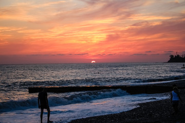 Fototapeta premium fabulous red, burgundy sky. Sunset on the sea.
