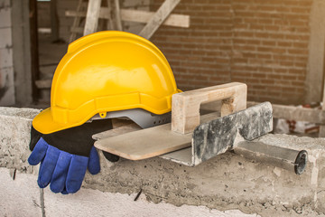 Worker put a helmet And tools after work break.