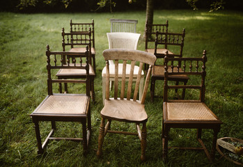 Fototapeta premium rows of old wooden chairs