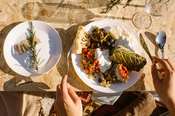 person eating a plate of vegan food