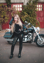 Plakat Beautiful woman on motorcycle outdoor. 