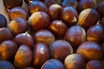 Chestnuts on a wooden bowl