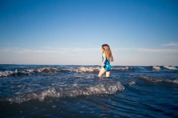 Child alone in the sea