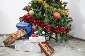 Christmas tree with many colored gifts and decorations