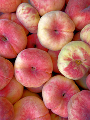 Fototapeta na wymiar fresh juicy peaches top view closeup, fruit background