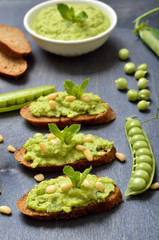 Vegeterian food. Sandwiches with green pea puree and pine nuts