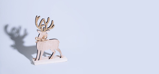 Cute reindeer chrismas decoration on bright background.