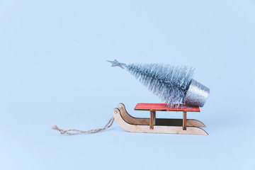Stylish vintage wooden sled with xmas tree.