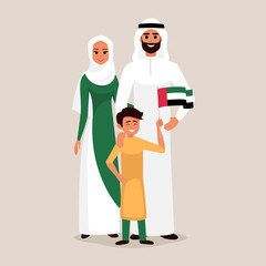 Happy family celebrating the United Arab Emirates Independence Day. Smiling Father, mother and son holding the flag of UAE.