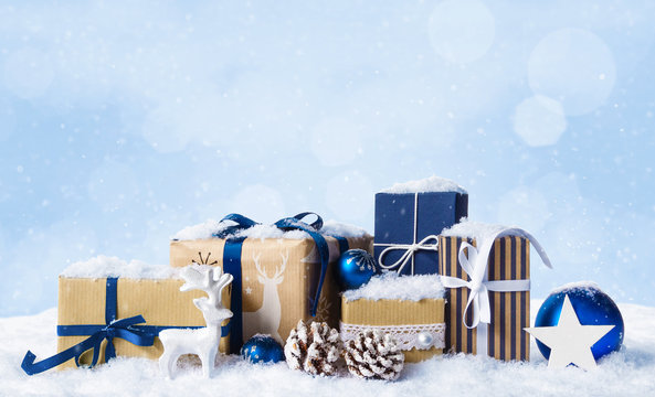 Christmas present boxes in snow.