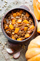 Spicy curry with green lentils, pumpkin and raisins