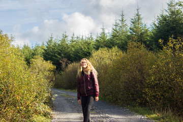 young girl in the mountains with glasses