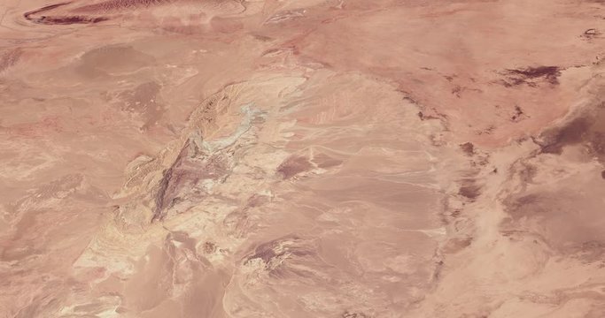 Very high-altitude circular tracking shot of Iran's Great Salt Desert. Reversible, seamless loop. Elements of this image furnished by NASA