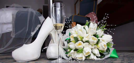 white shoes of the bride and bouquet
