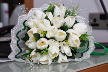white shoes of the bride and bouquet