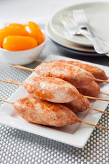 Minced turkey kebabs on square white plate