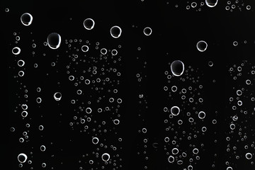 black wet background / raindrops for overlaying on window, concept of autumn weather, background of...