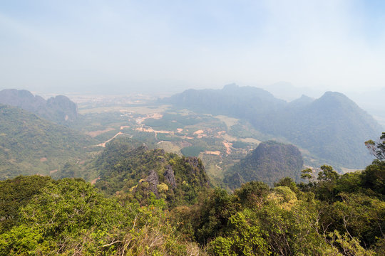 Scenic view of Vang Vieng and the surrounding area from above from the Phangern (Pha Ngern, Pha ngeun) mountain in Laos on a sunny day.