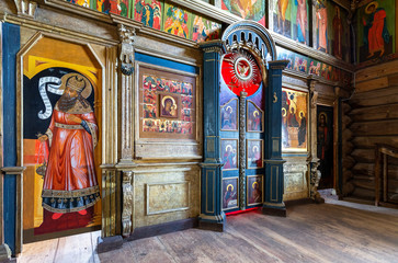Orthodox iconostasis inside the ancient wooden Trinity Church