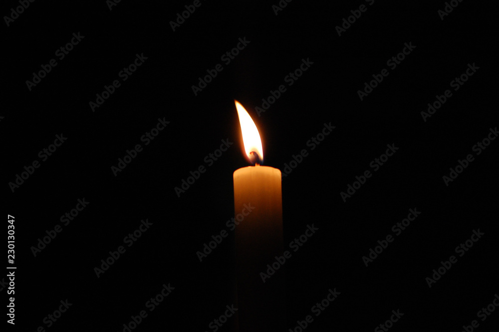 Wall mural candle in the dark