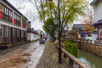 Fototapeta na wymiar Beautiufl canal of Suzhou under the rain, China