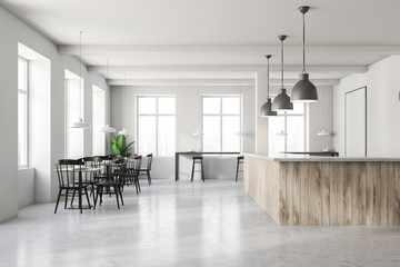 White cafe interior with wooden bar