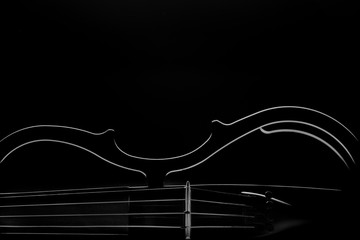 electronic violin on a black background © Rakursstudio
