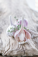 Garlic on the background of an old wooden table. Copy space