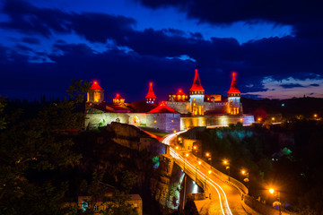 Amazing evening view of the medieval castle fortress in Kamianets-Podilskyi, Ukraine.