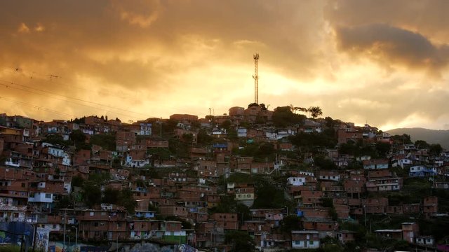 Dramatic yellow clouds over poor neighborhood in Comuna 13, Medellin Colombia
