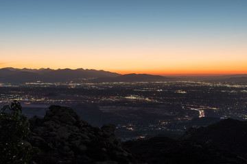 Fototapeta premium Predawn mountaintop cityscape view of the San Fernando Valley in Los Angeles California. Shot from Rocky Peak Park near Simi Valley. 