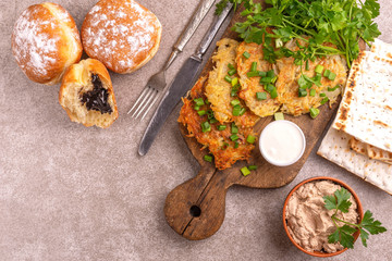 Tasty Hanukkah celebration food on vintage cutting board