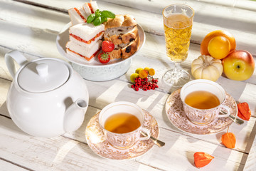 old school style tea at five afternoon service sandwich set cake sweet traditional table hotel cheesecake sugar pot china cup