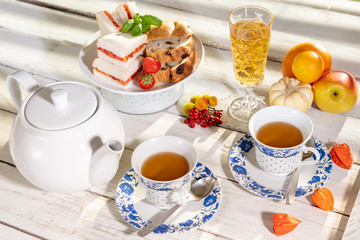 old school style tea at five afternoon service sandwich set cake sweet traditional table hotel cheesecake sugar pot china cup