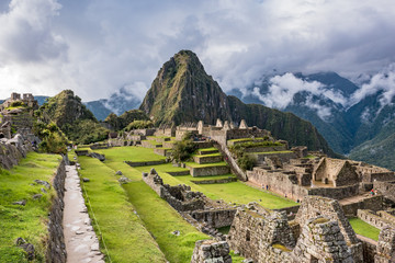 Long walkway into Machu Picchu above the ruins