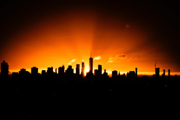 silhouette of city at sunset