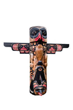 Totem pole with eagle isolated on white background