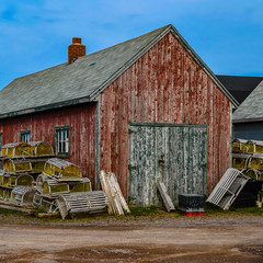 A scenic view of a fisherman's shack with lobster gear in Parrsboro, Nova Scotia.