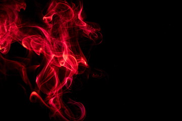 Red smoke on black background