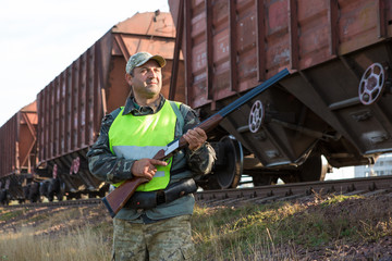 Hunters with a german drathaar and spaniel, pigeon hunting with dogs in reflective vests	