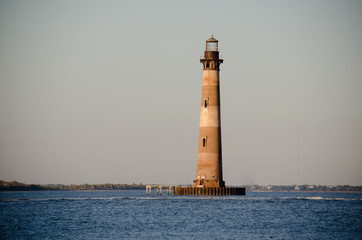 Morris Island Lighthouse at sunset in Folly Beach South Carolina