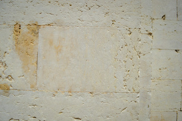 Closeup of natural pattern of stone wall building textured background.