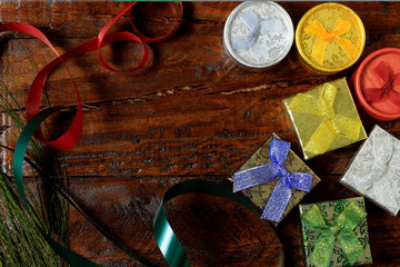 Christmas composition. Christmas gifts on wooden table. Top view, empty space, cardboard