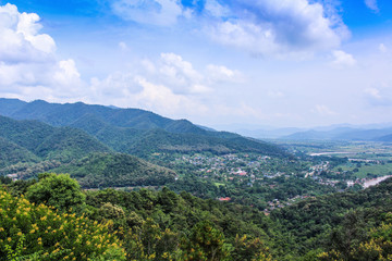 Fototapeta na wymiar Landscape mountains view on blue clouds sky background of Tha Ton city in Mae Ai , Chiang Mai,Thailand