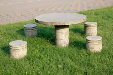 stone table and chair in the park