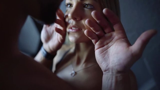 Close-up shot of a strong man's hand fondling sexy woman's face, sensual lips, desired woman.